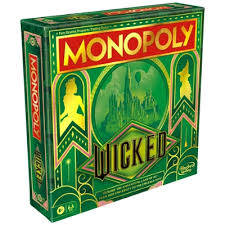 Monopoly: Wicked board game setup showing a magical-themed board, spell cards, player tokens, money, and houses ready for play.