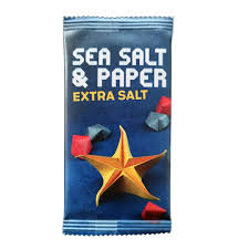 Sea Salt & Paper snack package with star-shaped snacks on a blue background. Sea Salt and Paper Extra Salt expansion card game available at MJ BoardGames Lebanon