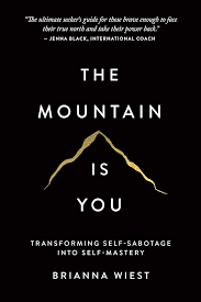 Book cover of 'The Mountain Is You' by Brianna Wiest with a mountain graphic and text. available at MJ BoardGames Lebanon
