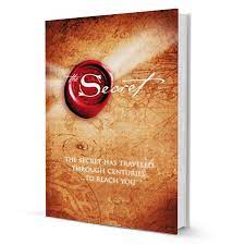 Book titled 'The Secret' with a red gemstone on a textured background. available at MJ BoardGames Lebanon